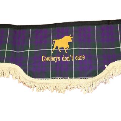 A bold and stylish truck pelmet featuring a striking bull graphic and “Cowboys don’t care” slogan on a tartan background, finished with decorative fringe for a classic cab look. Whiterig Truck Curtains